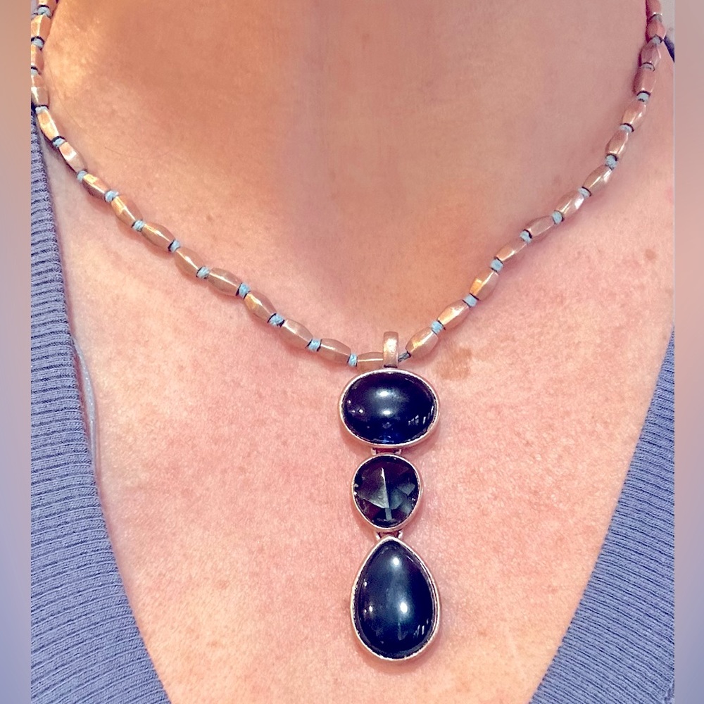 Lovely blue 3-stone pendant on brushed gold chain